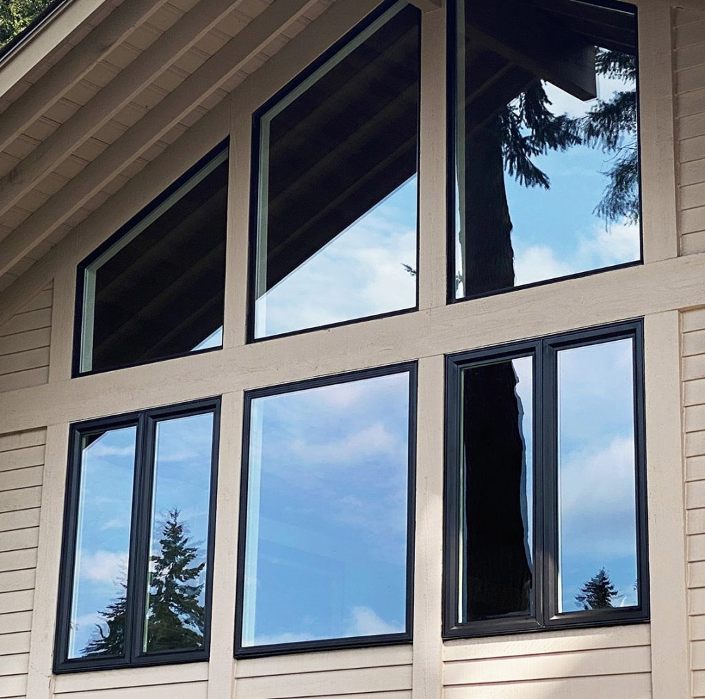 Custom Remodelers Inc. crew installing windows on a Minneapolis home