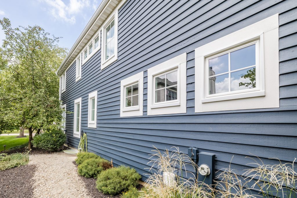 Custom Remodelers Inc. installing replacement windows on a Minneapolis home